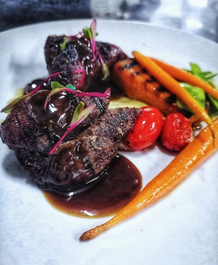 Beef fillet with red wine jus and glazed baby carrots